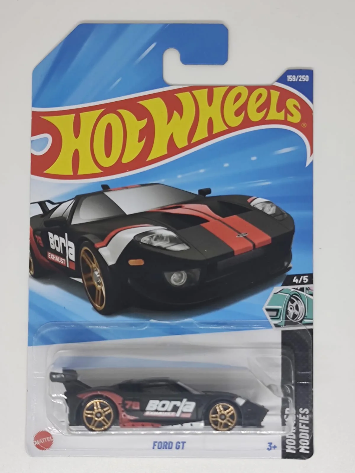 Ford GT — negro con franjas rojas, decoración Borla y ruedas doradas